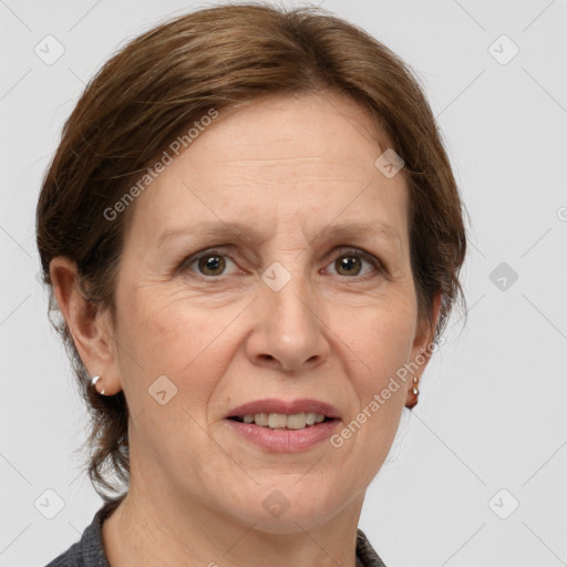 Joyful white adult female with medium  brown hair and grey eyes