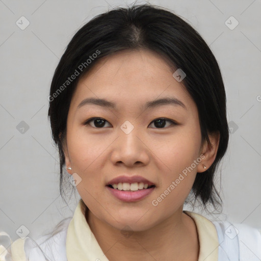 Joyful asian young-adult female with medium  black hair and brown eyes