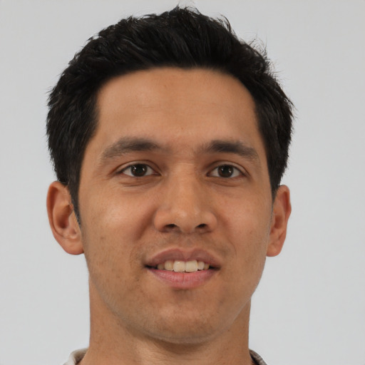 Joyful asian young-adult male with short  brown hair and brown eyes