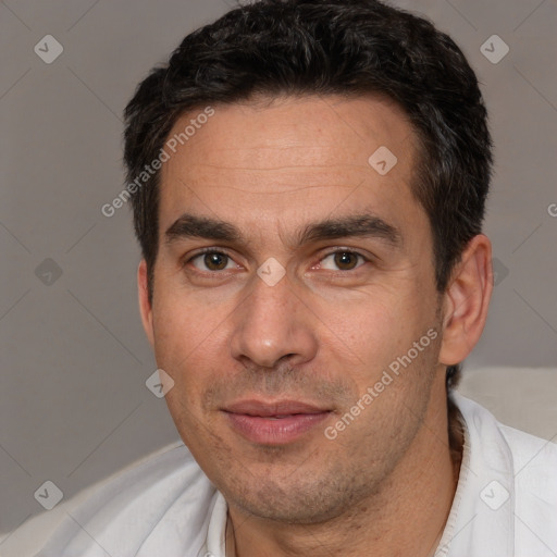 Joyful white adult male with short  brown hair and brown eyes