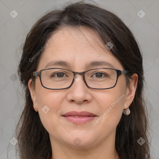 Joyful white adult female with medium  brown hair and grey eyes