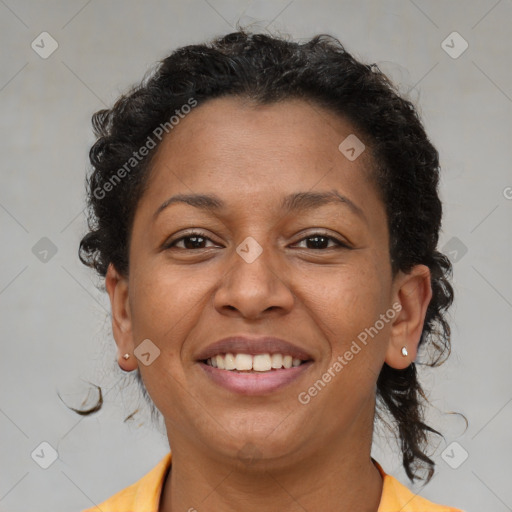 Joyful latino adult female with medium  brown hair and brown eyes