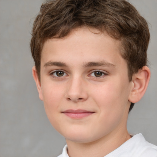 Joyful white child male with short  brown hair and brown eyes