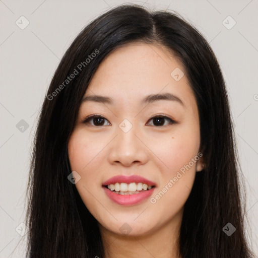 Joyful asian young-adult female with long  brown hair and brown eyes