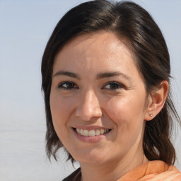 Joyful white adult female with medium  brown hair and brown eyes