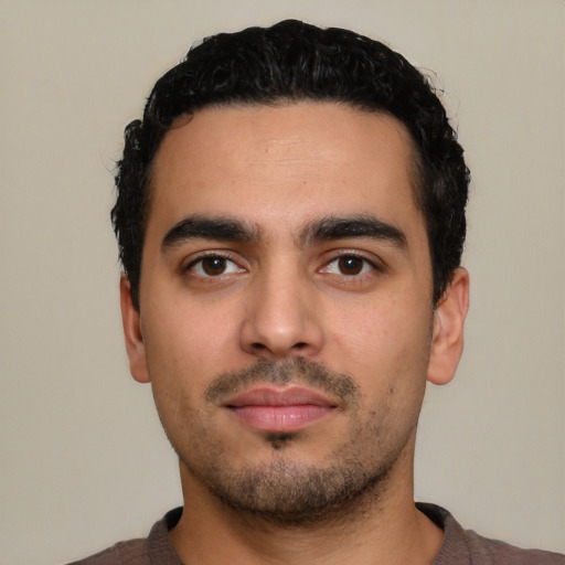 Neutral latino young-adult male with short  black hair and brown eyes