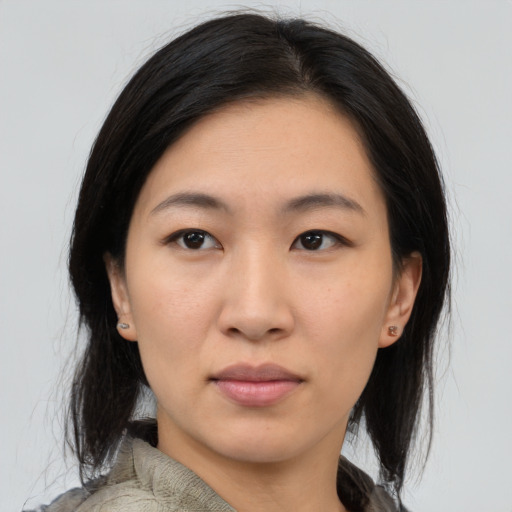 Neutral asian young-adult female with medium  brown hair and brown eyes