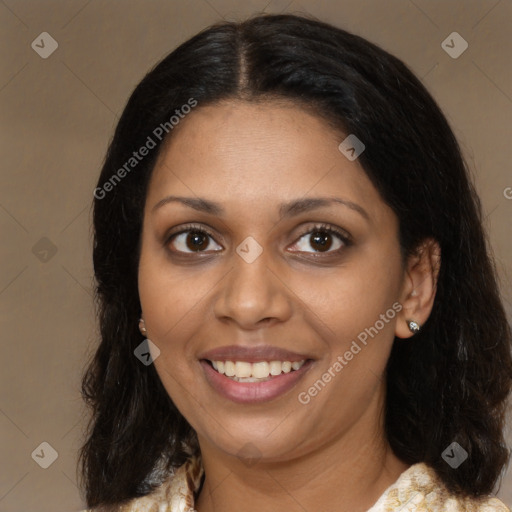 Joyful black young-adult female with medium  brown hair and brown eyes