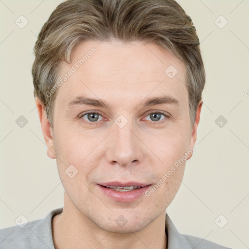 Joyful white adult male with short  brown hair and grey eyes