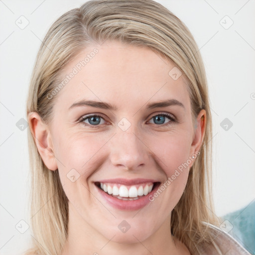 Joyful white young-adult female with long  brown hair and blue eyes