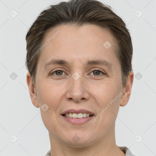 Joyful white adult female with short  brown hair and grey eyes