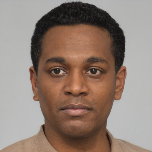 Neutral black young-adult male with short  black hair and brown eyes