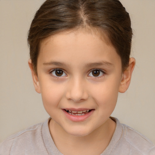 Joyful white child female with short  brown hair and brown eyes