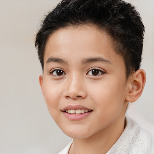 Joyful white child male with short  brown hair and brown eyes