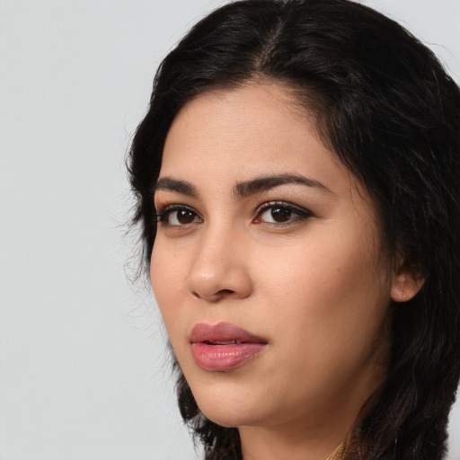 Neutral latino young-adult female with long  black hair and brown eyes