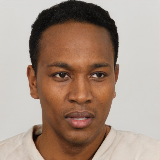 Neutral black young-adult male with short  black hair and brown eyes