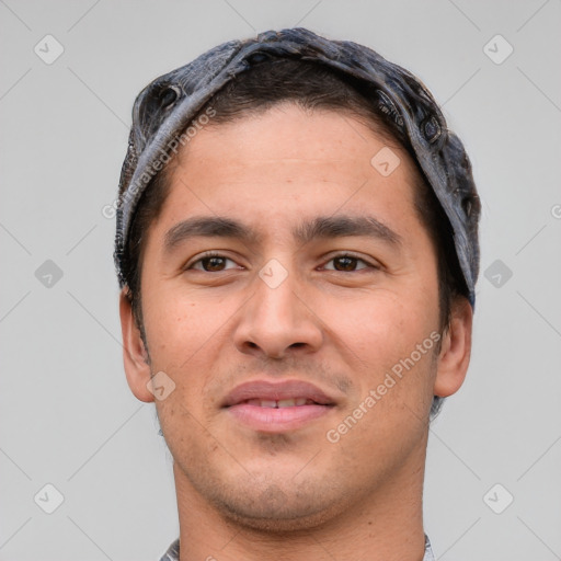 Joyful white young-adult male with short  black hair and brown eyes