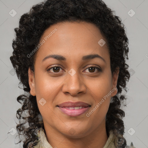 Joyful black young-adult female with long  brown hair and brown eyes