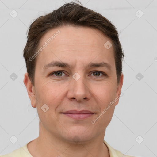 Joyful white adult male with short  brown hair and grey eyes