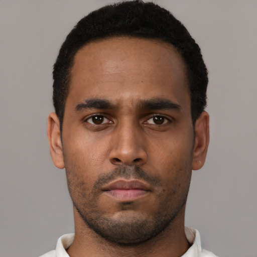 Neutral black young-adult male with short  black hair and brown eyes