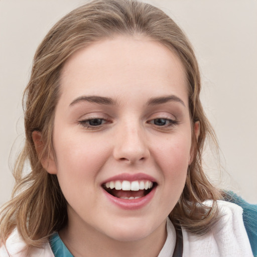 Joyful white young-adult female with medium  brown hair and blue eyes