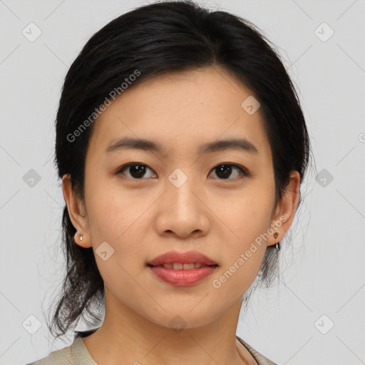 Joyful asian young-adult female with medium  brown hair and brown eyes