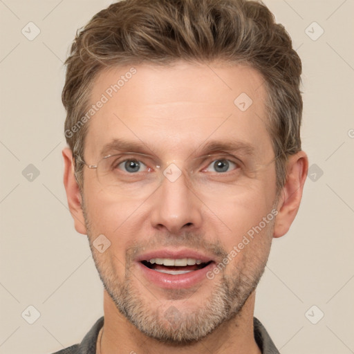 Joyful white adult male with short  brown hair and grey eyes