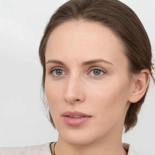 Neutral white young-adult female with medium  brown hair and grey eyes