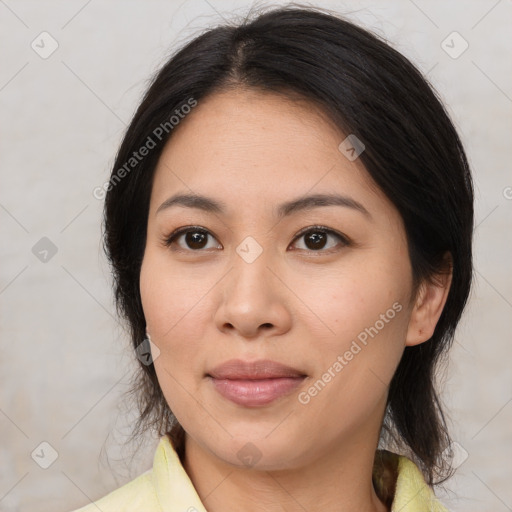 Joyful asian young-adult female with medium  brown hair and brown eyes