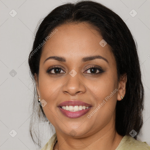 Joyful latino young-adult female with medium  brown hair and brown eyes