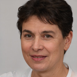 Joyful white adult female with short  brown hair and brown eyes