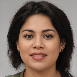 Joyful asian young-adult female with long  brown hair and brown eyes