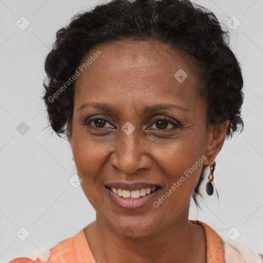 Joyful black adult female with short  brown hair and brown eyes