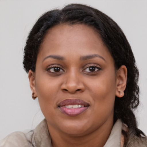 Joyful latino young-adult female with medium  brown hair and brown eyes