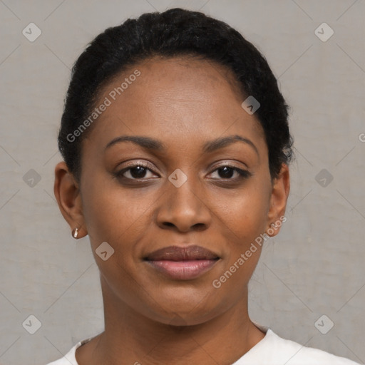 Joyful black young-adult female with short  black hair and brown eyes