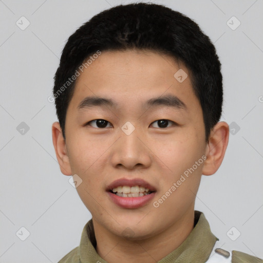 Joyful asian young-adult male with short  black hair and brown eyes