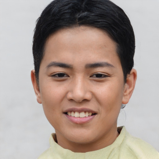 Joyful asian young-adult female with short  brown hair and brown eyes