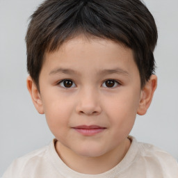 Joyful white child male with short  brown hair and brown eyes