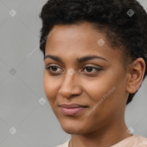 Joyful black young-adult female with short  brown hair and brown eyes