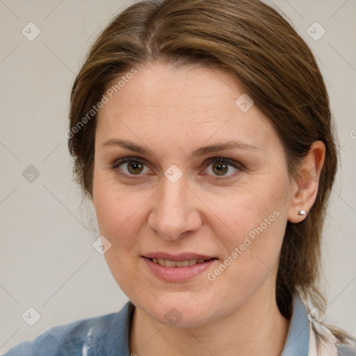 Joyful white adult female with medium  brown hair and blue eyes