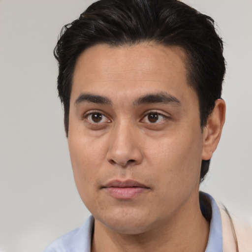 Neutral latino young-adult male with short  black hair and brown eyes