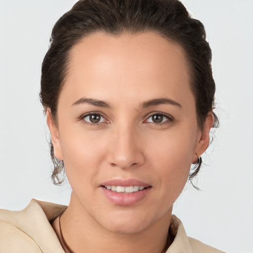 Joyful white young-adult female with medium  brown hair and brown eyes