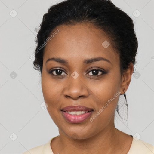 Joyful black young-adult female with medium  black hair and brown eyes