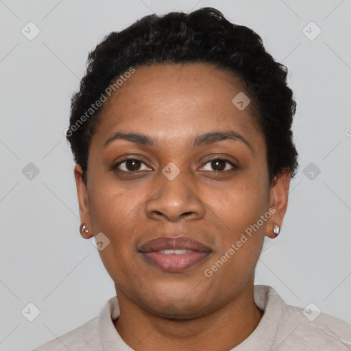 Joyful black young-adult female with short  black hair and brown eyes