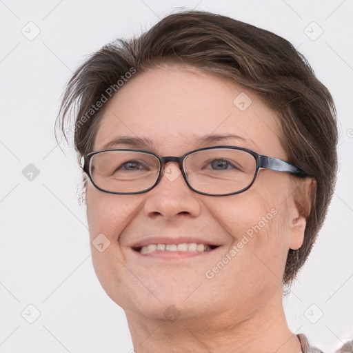 Joyful white adult female with short  brown hair and grey eyes