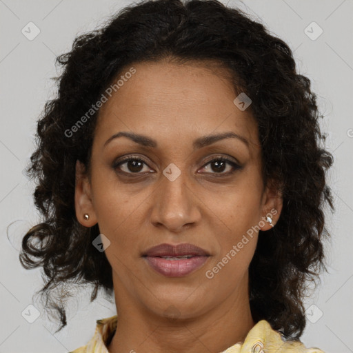 Joyful black adult female with medium  brown hair and brown eyes