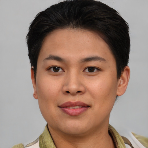 Joyful asian young-adult female with short  brown hair and brown eyes