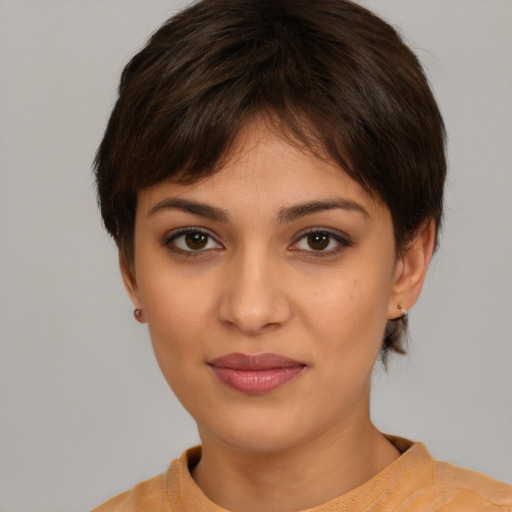 Joyful white young-adult female with short  brown hair and brown eyes