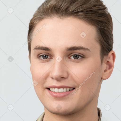 Joyful white young-adult female with short  brown hair and grey eyes