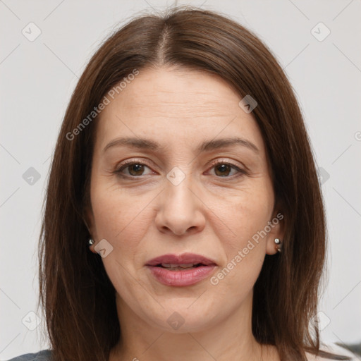 Joyful white adult female with medium  brown hair and brown eyes